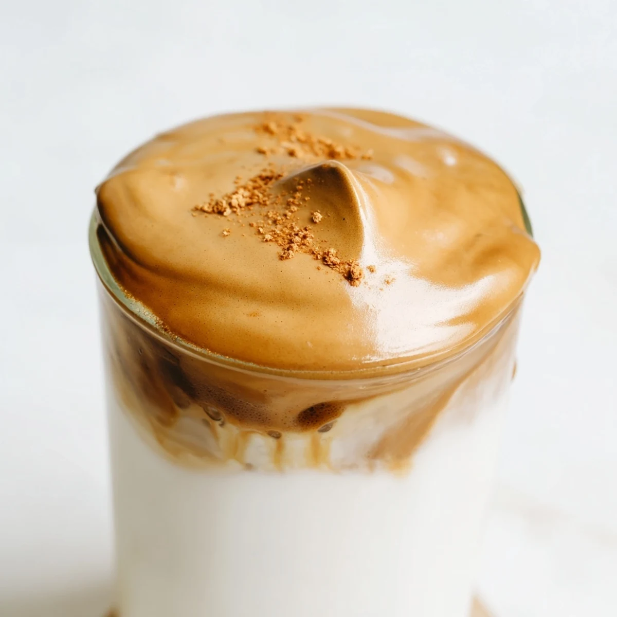 A chilled glass filled with creamy Brown Sugar Dalgona Latte, ready to be sipped and savored.