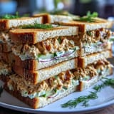 Delicate finger sandwiches with tangy lemon butter and fresh cucumber, perfect for a Mothers Day tea party.