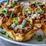 Golden brown mini taco cups filled deliciously, great for parties and easy dinners.
