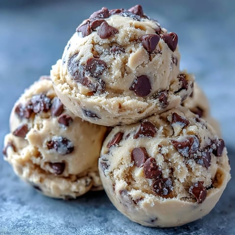 Scoops of Greek Yogurt Cookie Dough feature creamy buttery texture with mini chocolate chips ready to enjoy chilled from the fridge.