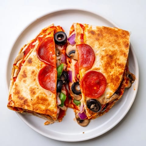 Crispy, folded tortilla pizza wrap, featuring bubbling cheese and your favorite veggie toppings.