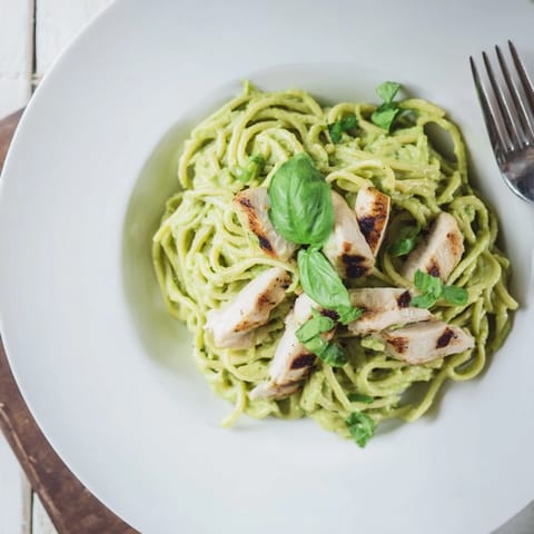 Freshly blended avocado sauce coats al dente spaghetti and tender grilled chicken in this colorful, creamy avocado chicken pasta dish.