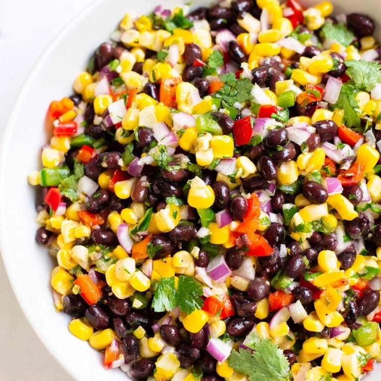 Vibrant Cowboy Caviar Salad with black beans and corn, perfect with crisp tortilla chips.