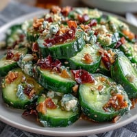 A vibrant smashed cucumber salad with garlic chili oil, crunchy and spicy, perfect for summer meals.